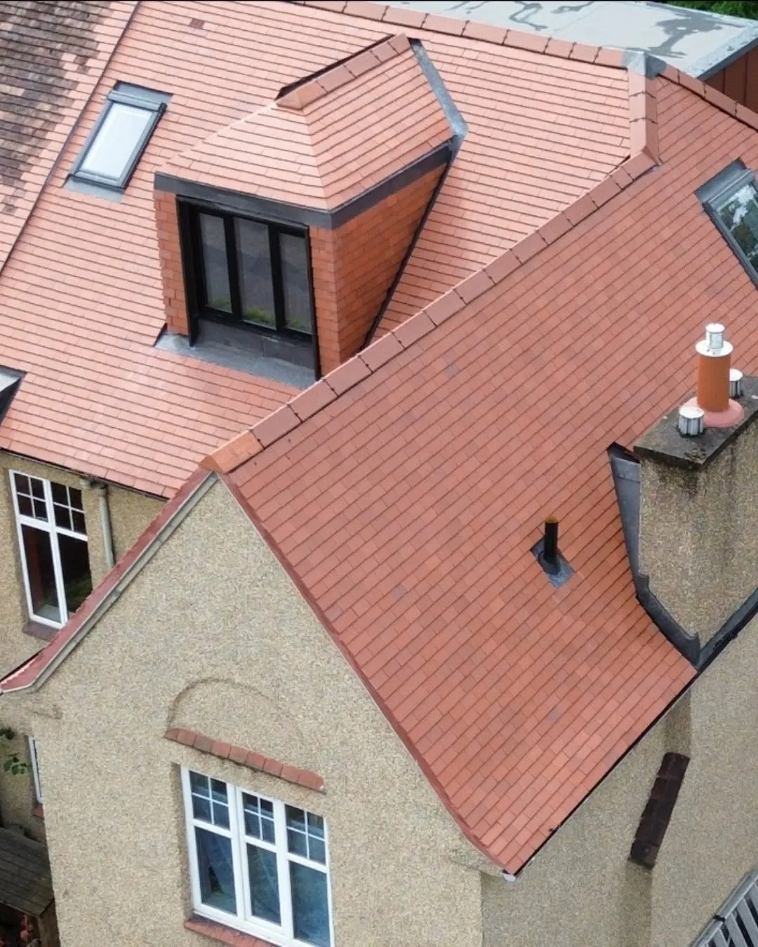 Close-up of new clay tiles, dormer and lead work